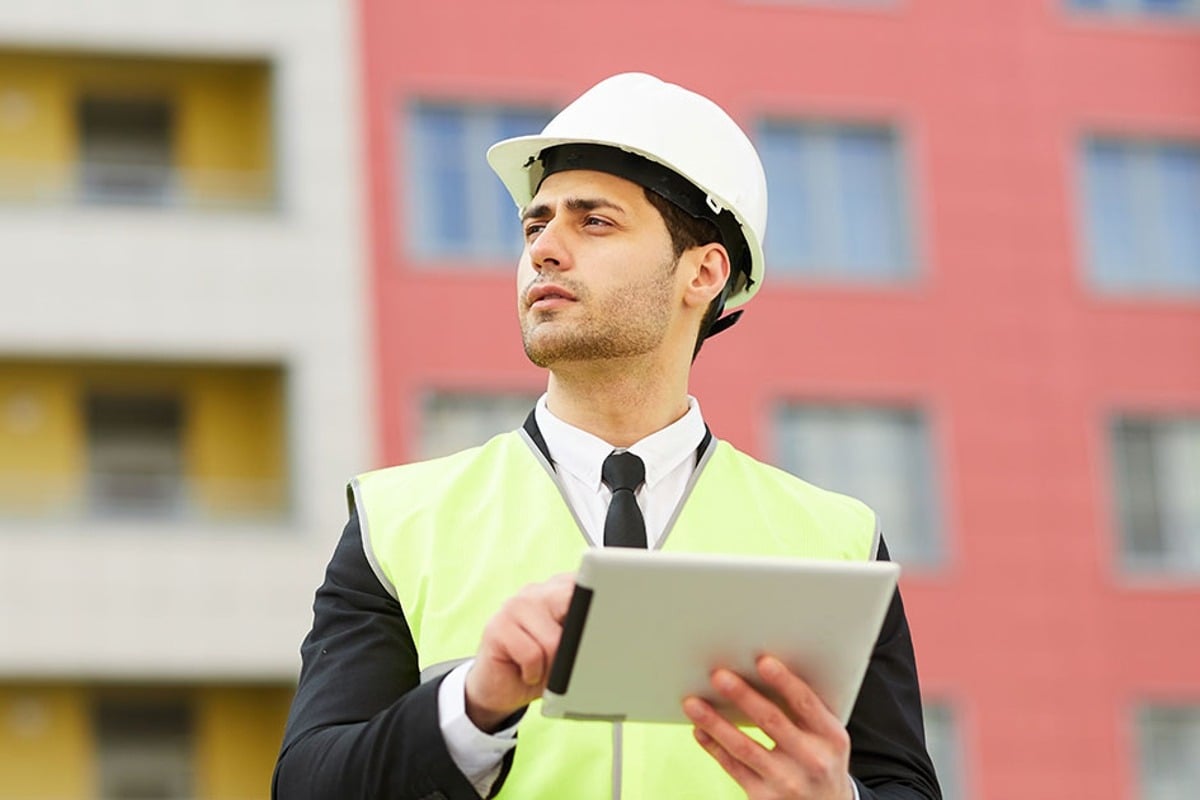 Featured image: employee wearing hard hat - Read full post: 7 Knowledge Management Capabilities EPCs Will Need to Compete in 2022